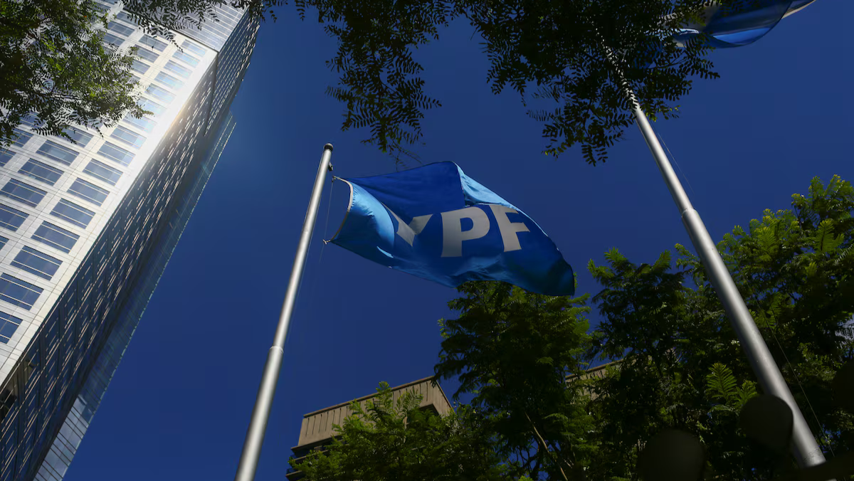 YPF flag waving outside corporate building, highlighting Argentina’s Vaca Muerta shale expansion.